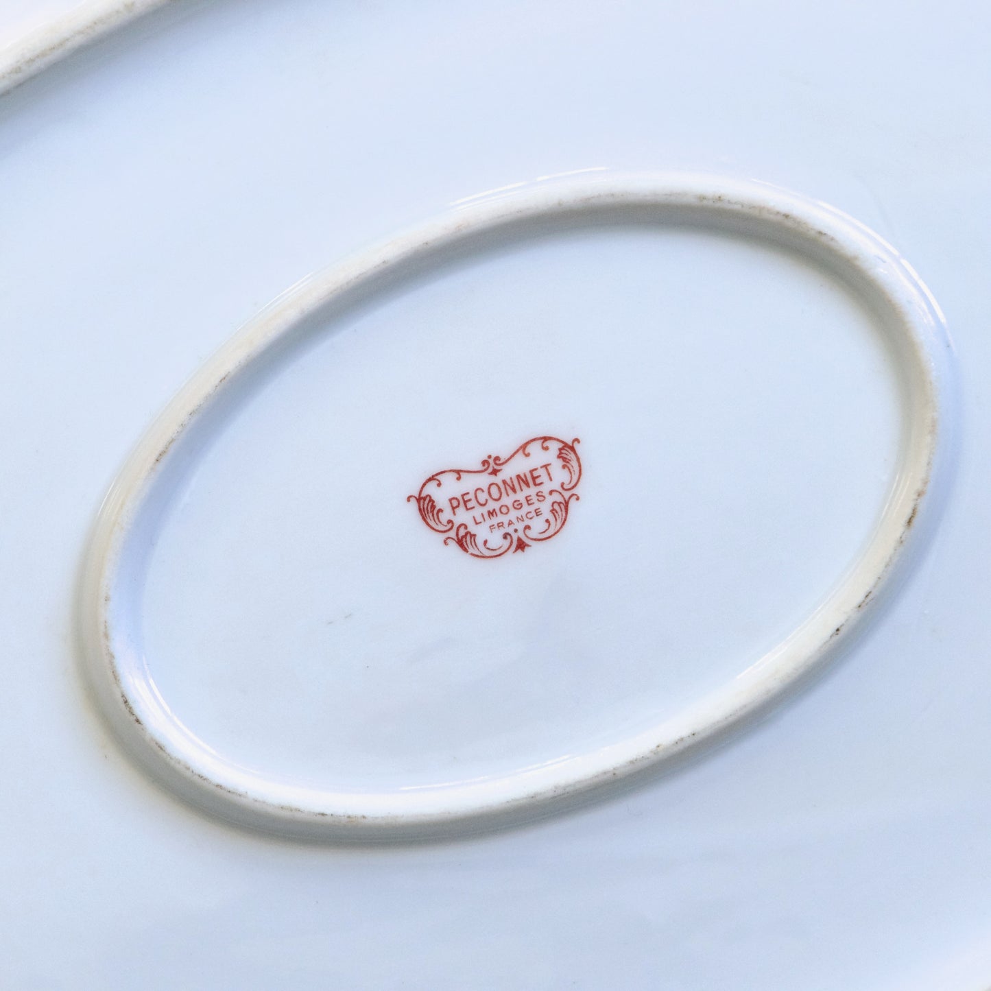 Très grand plat ovale en porcelaine de Limoges "Peconnet"