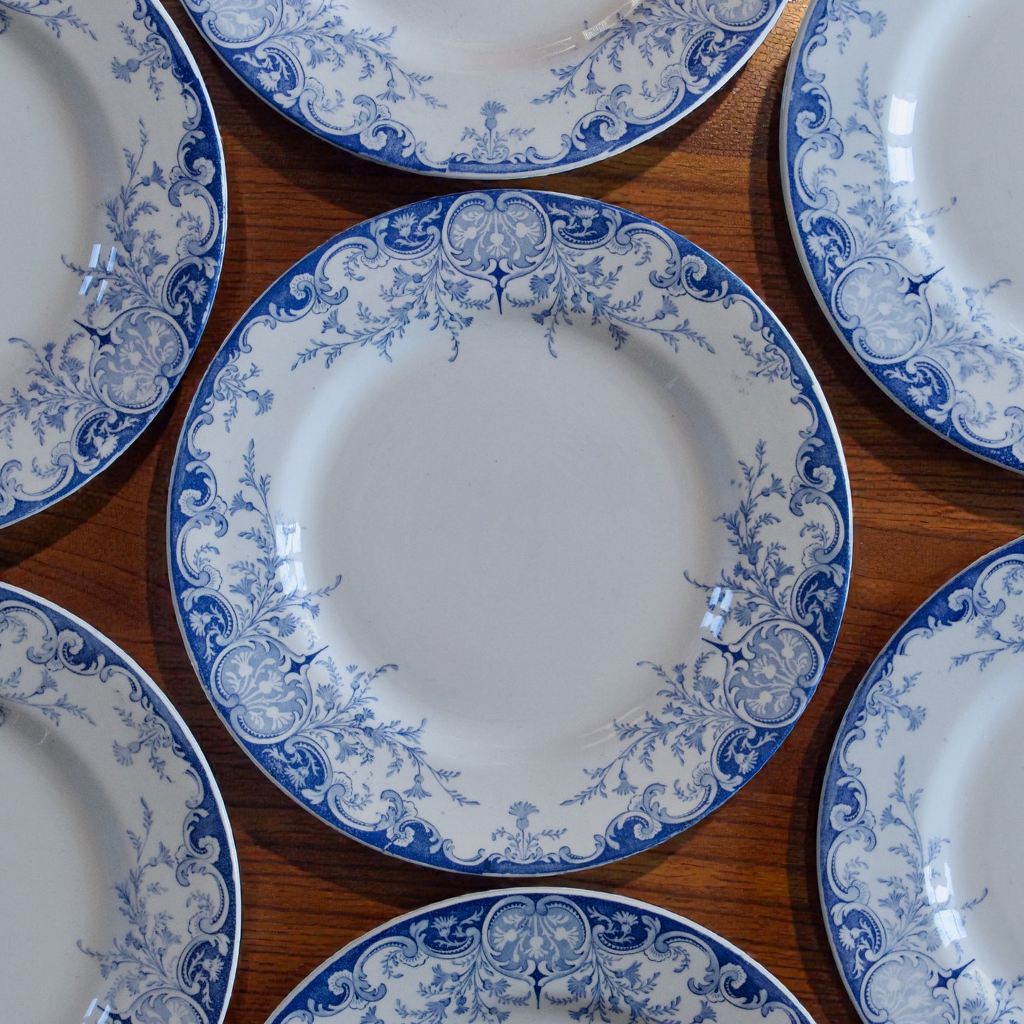 7 assiettes plates KG Luneville "Phénix" - terre de fer
